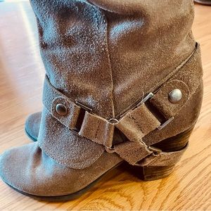 Rustic suede knee-high boots. Comfortable and durable through wet weather.